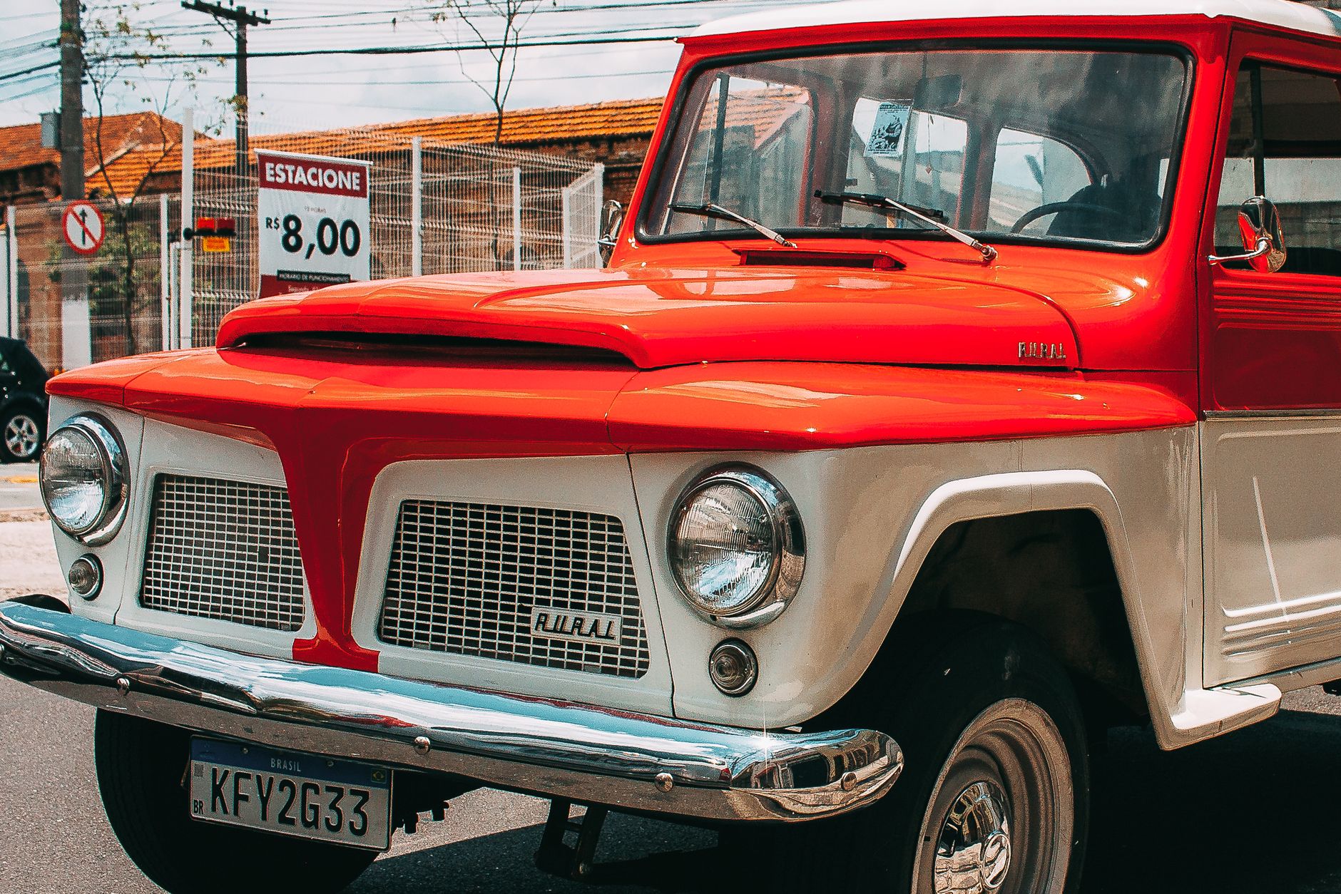 Classic red jeep parked outdoors on a sunny day. Perfect for vintage motor vehicle enthusiasts.