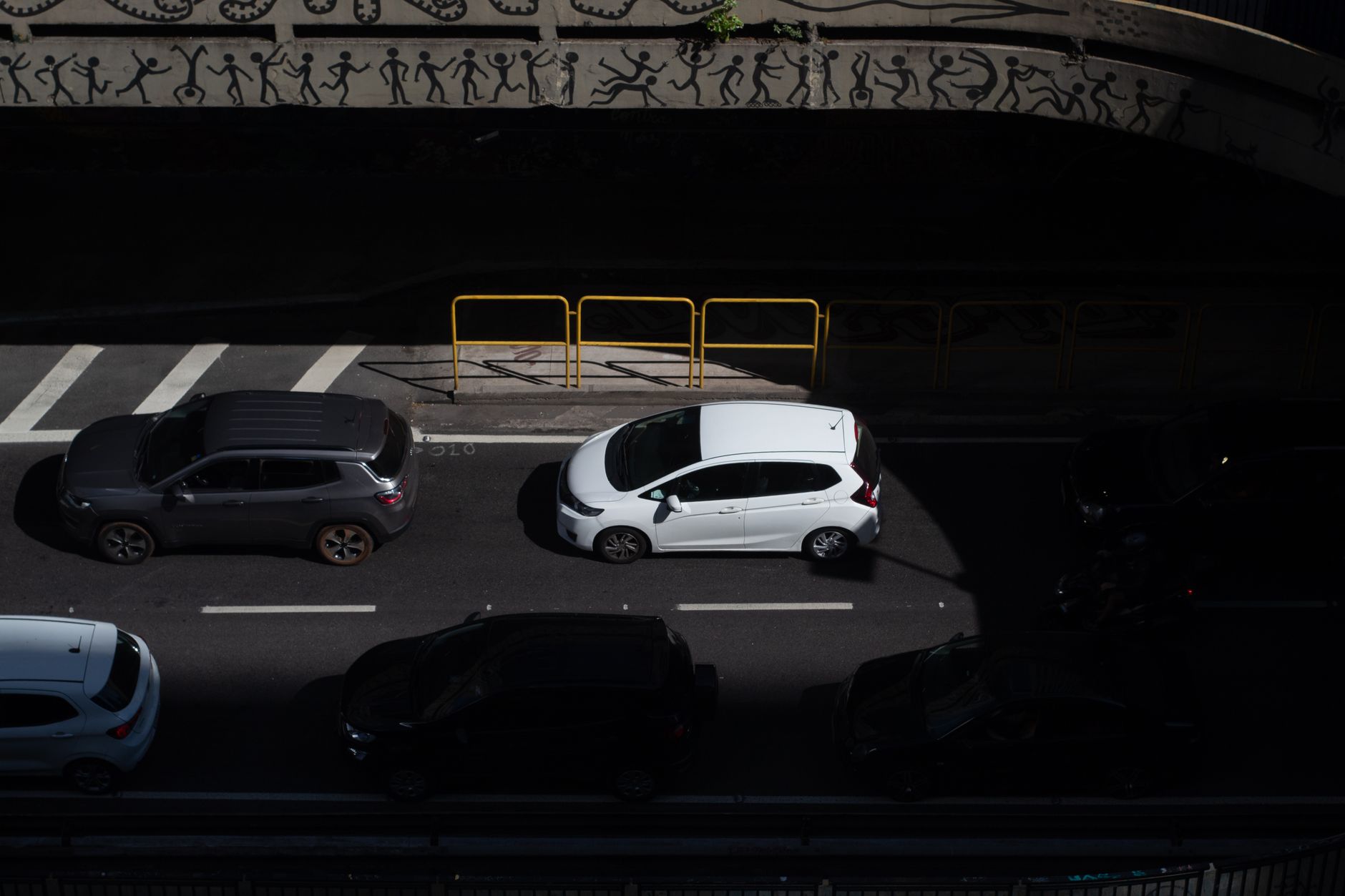 Overhead shot of vehicles on a street in São Paulo, Brazil, highlighting urban traffic.