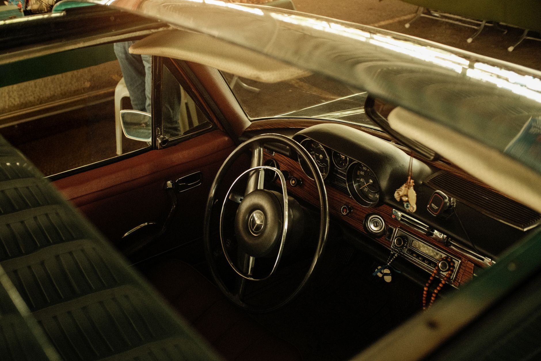 Interior view of a vintage car showing its classic design and elegant steering wheel.
