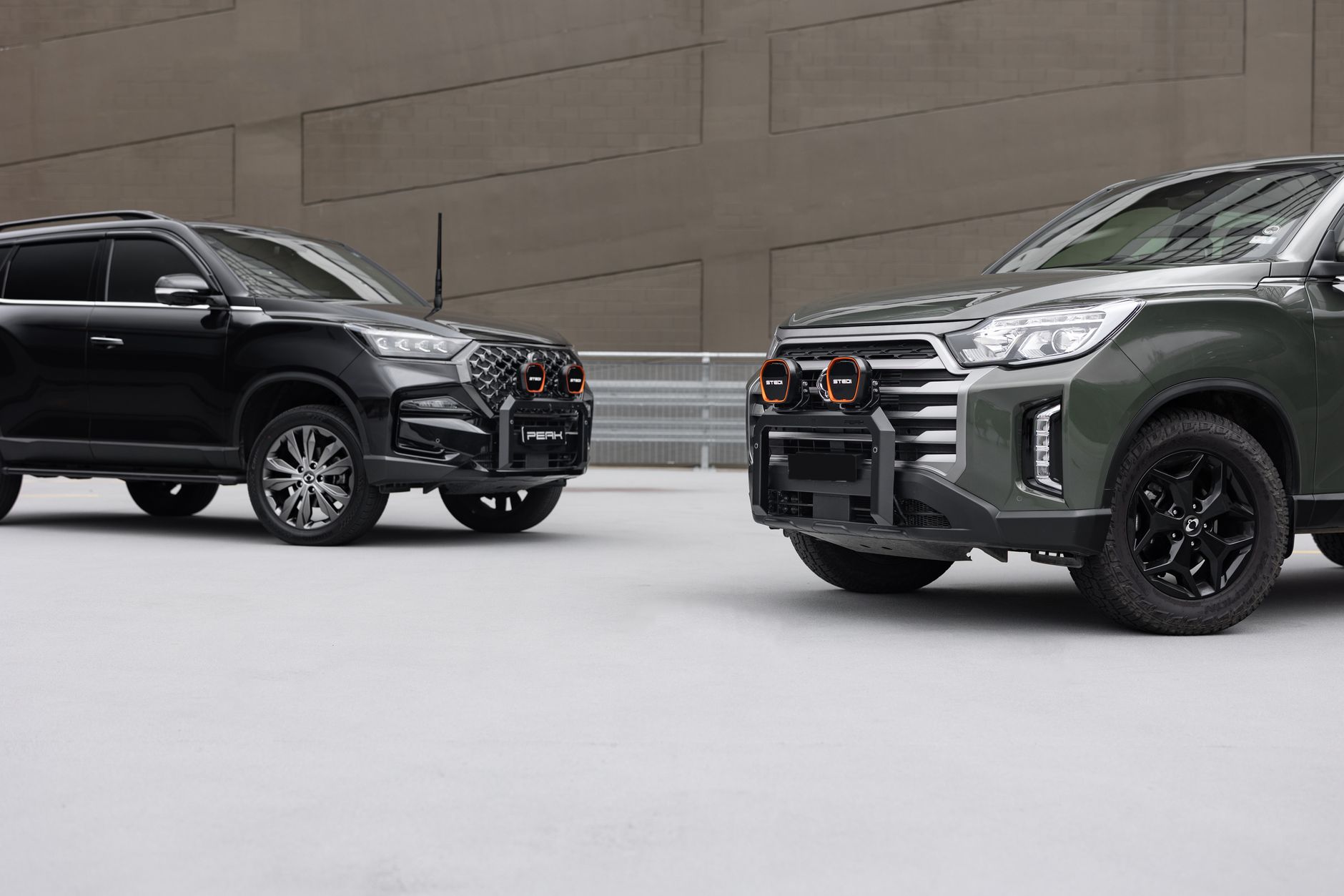 Capture of two modern SUVs showcasing stylish design and robust build in an urban environment.