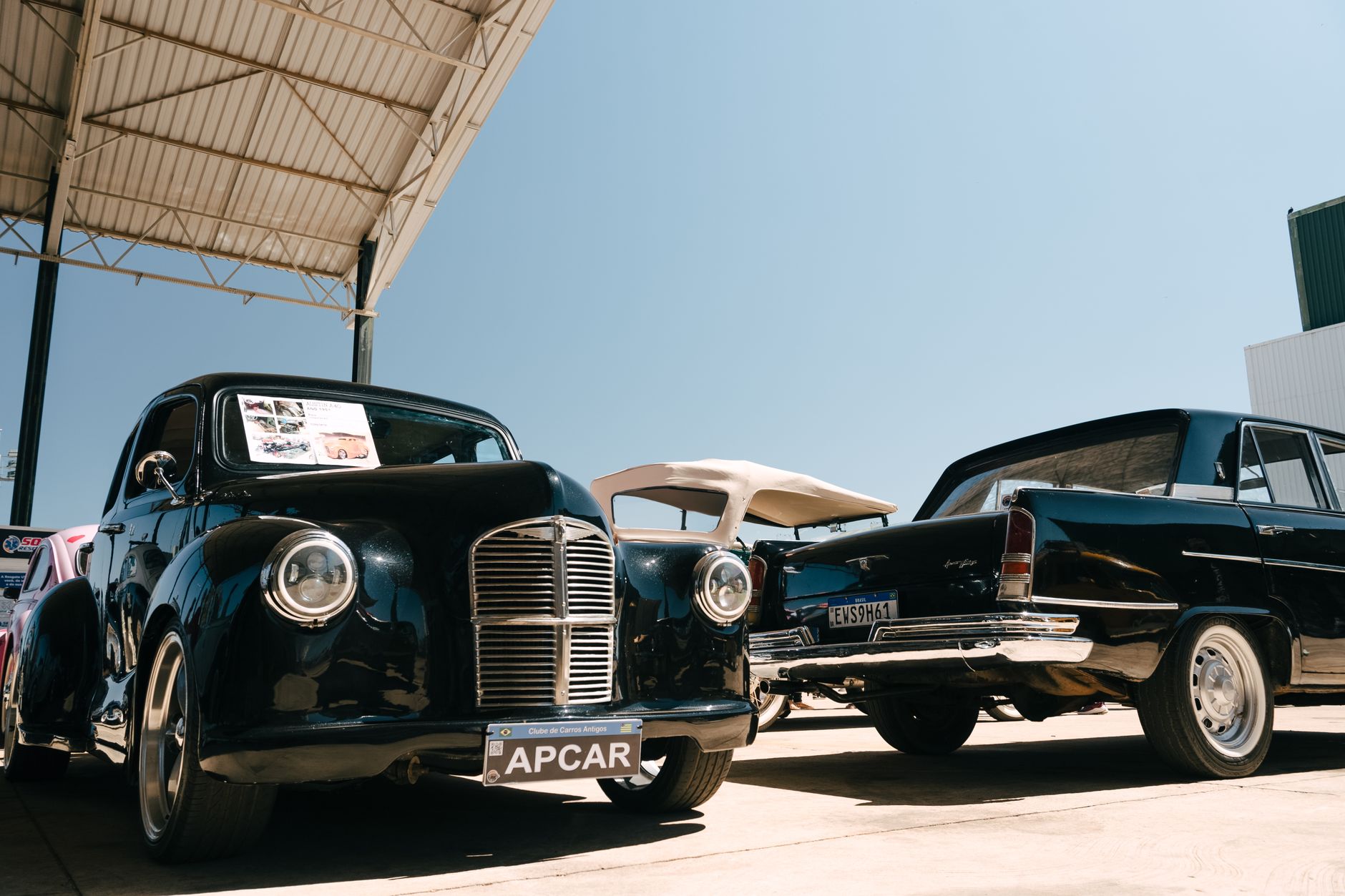 Showcasing elegant vintage and retro cars at an outdoor classic car exhibition.