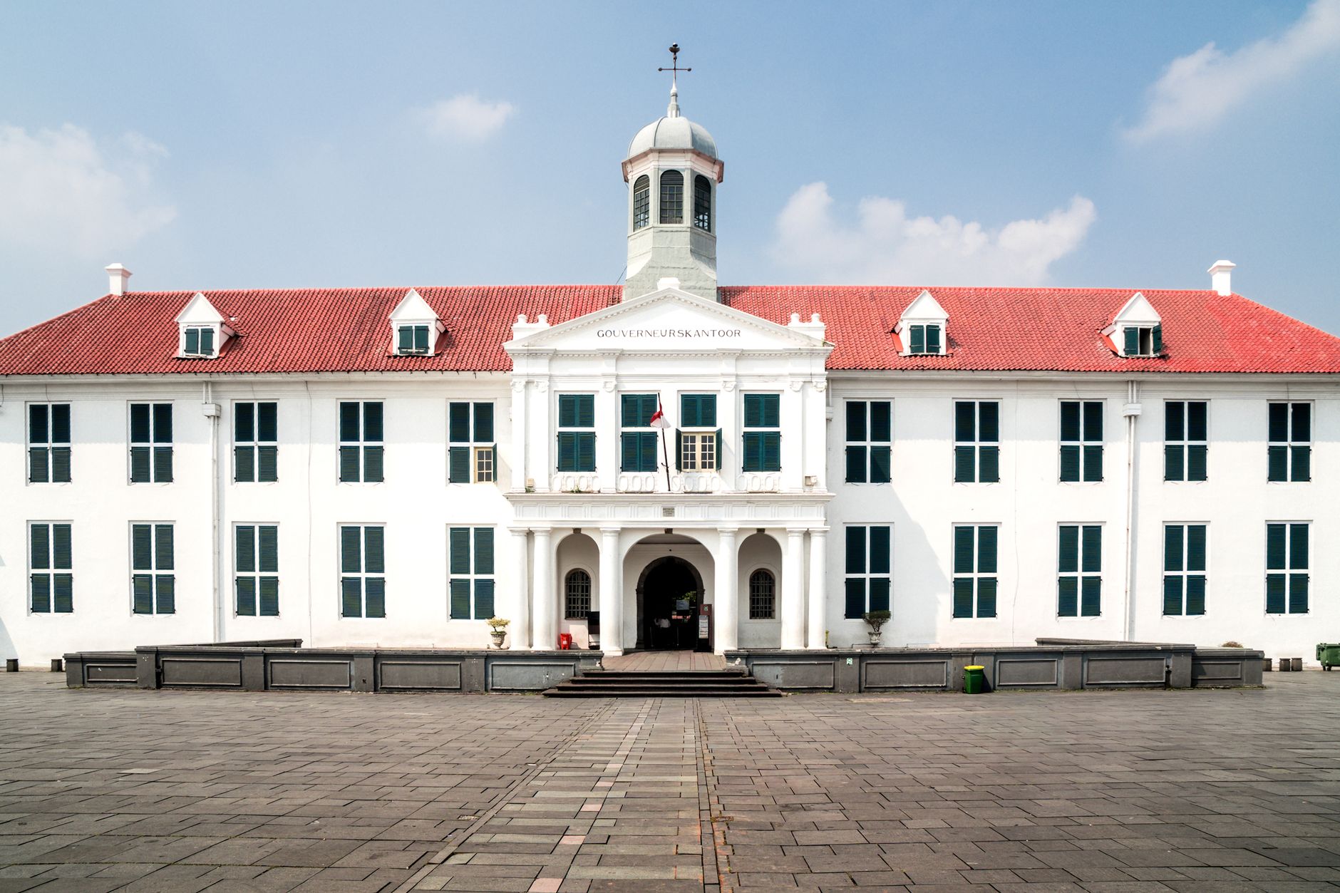 Front view of the historic Fatahillah Museum in Jakarta, Indonesia, with a clear blue sky.