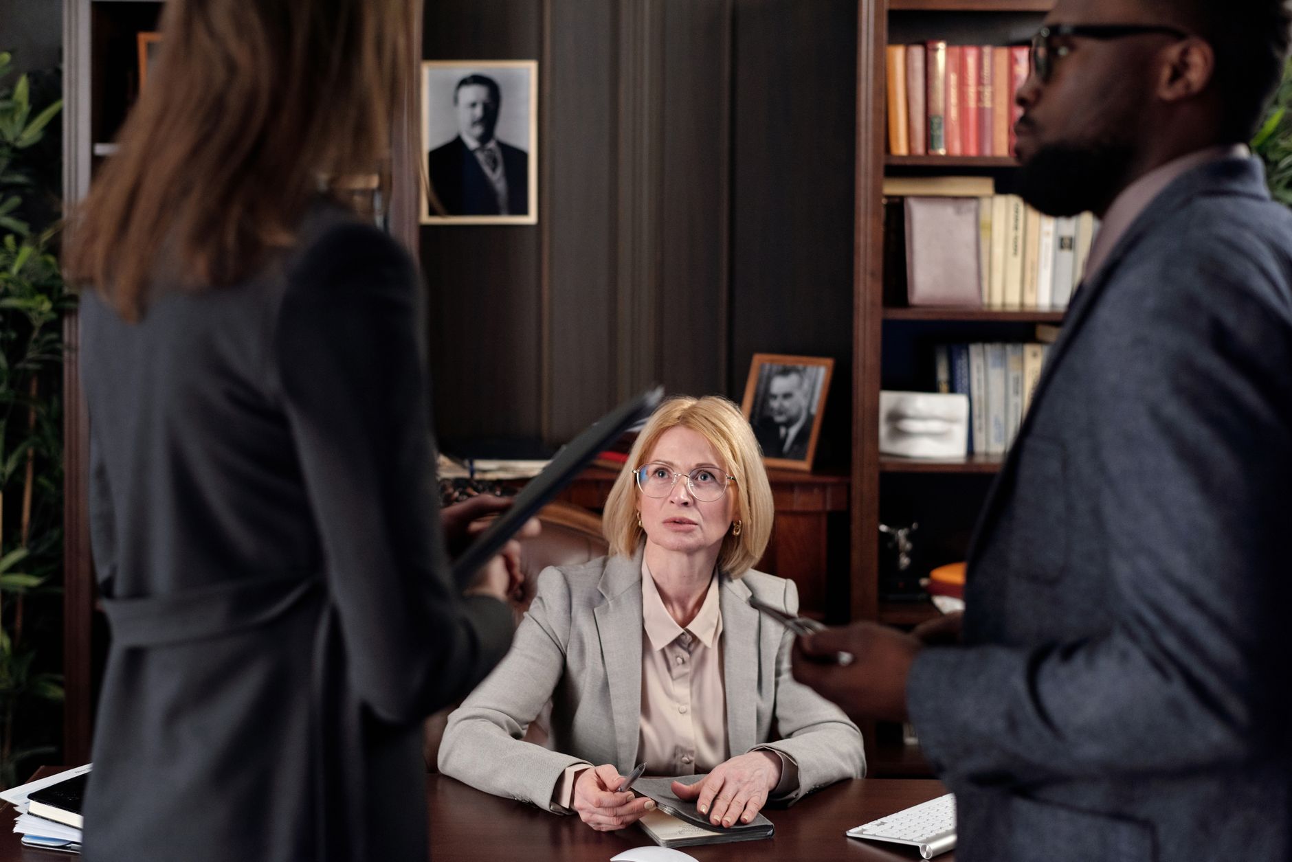 Diverse team discussing strategies in a professional office setting.