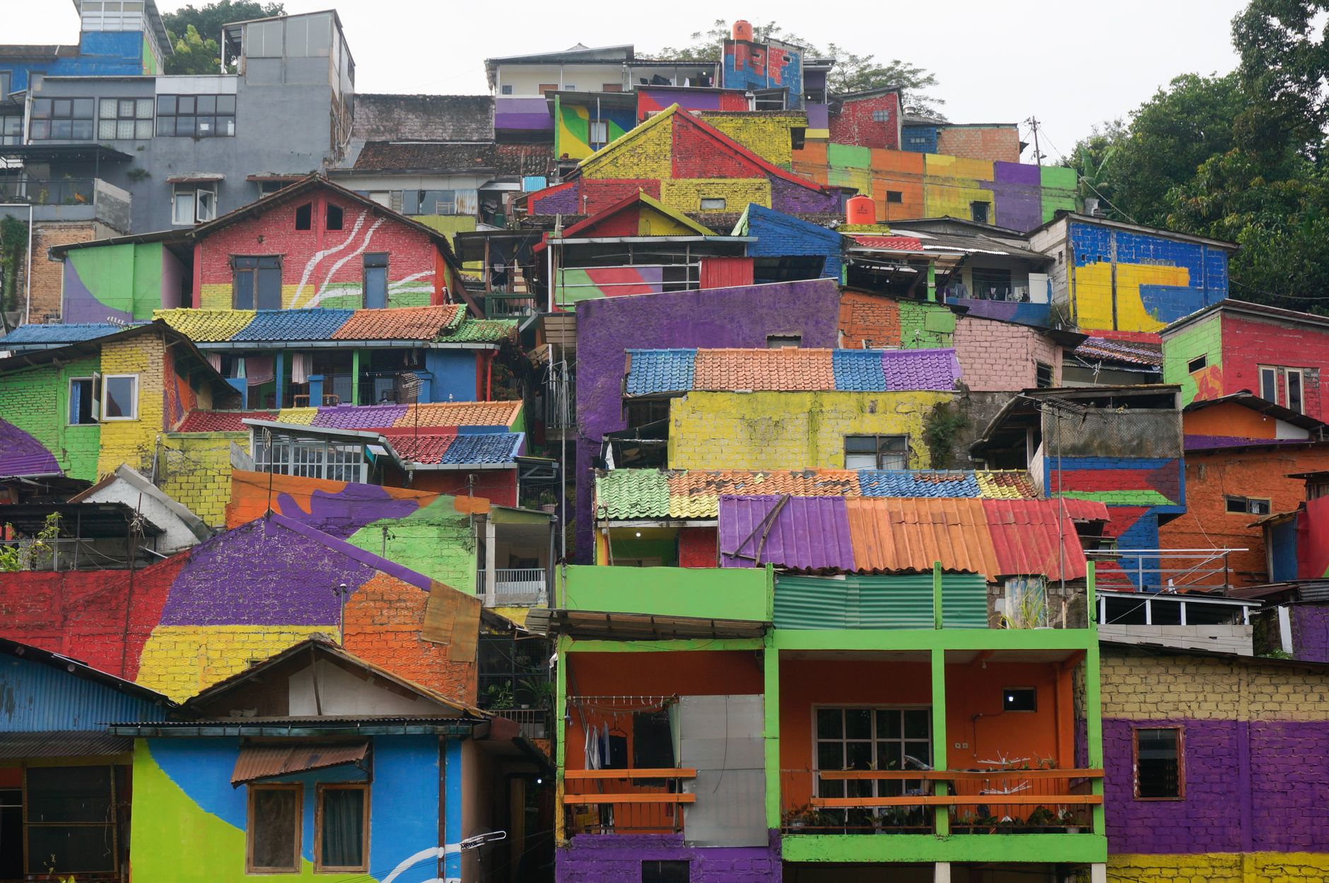 Vibrant, multicolored hillside homes in an urban setting create a stunning visual.