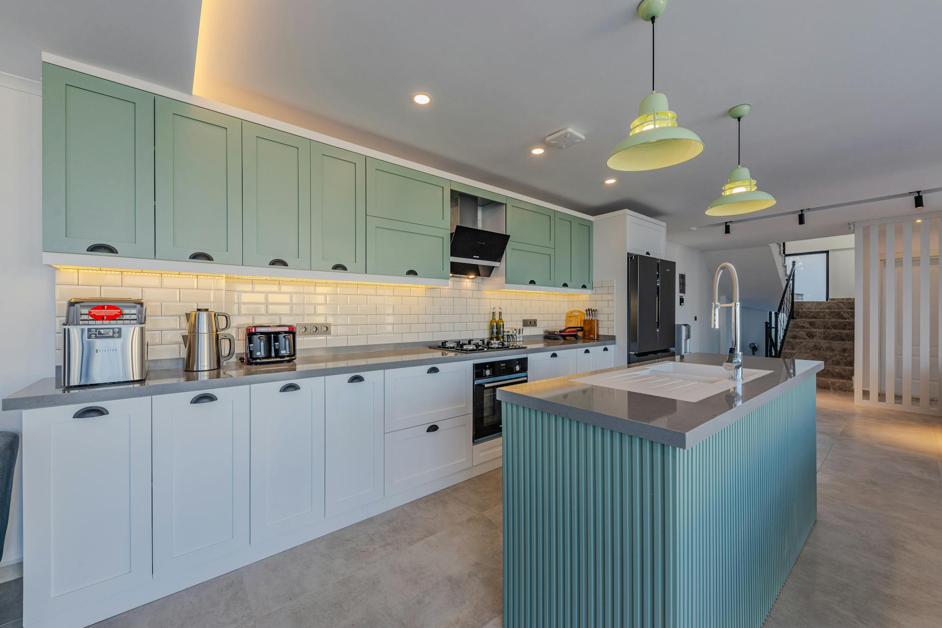 Stylish kitchen featuring contemporary design, an island, and modern appliances.