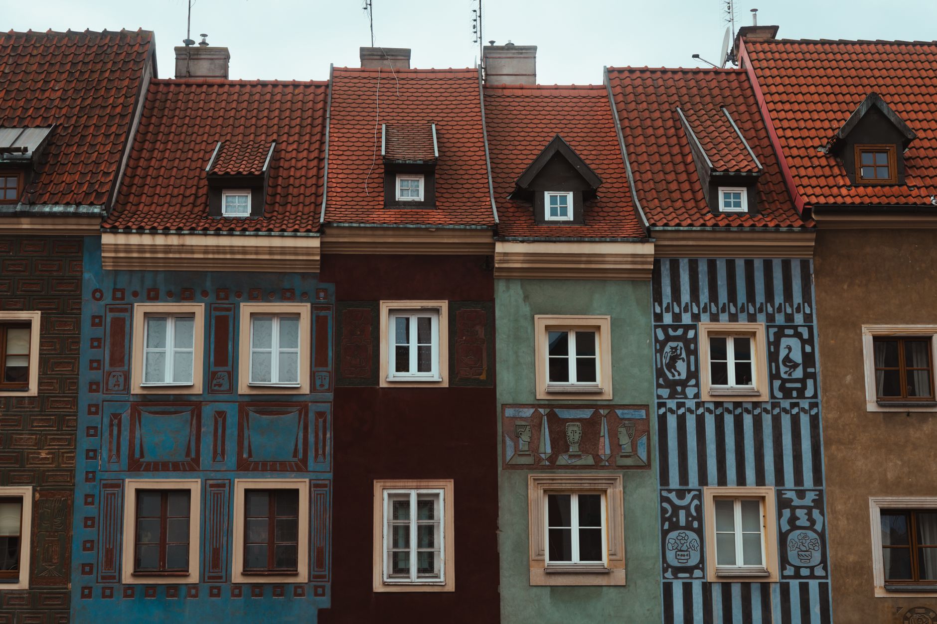 Vibrant traditional buildings in Poznań's historic old town.