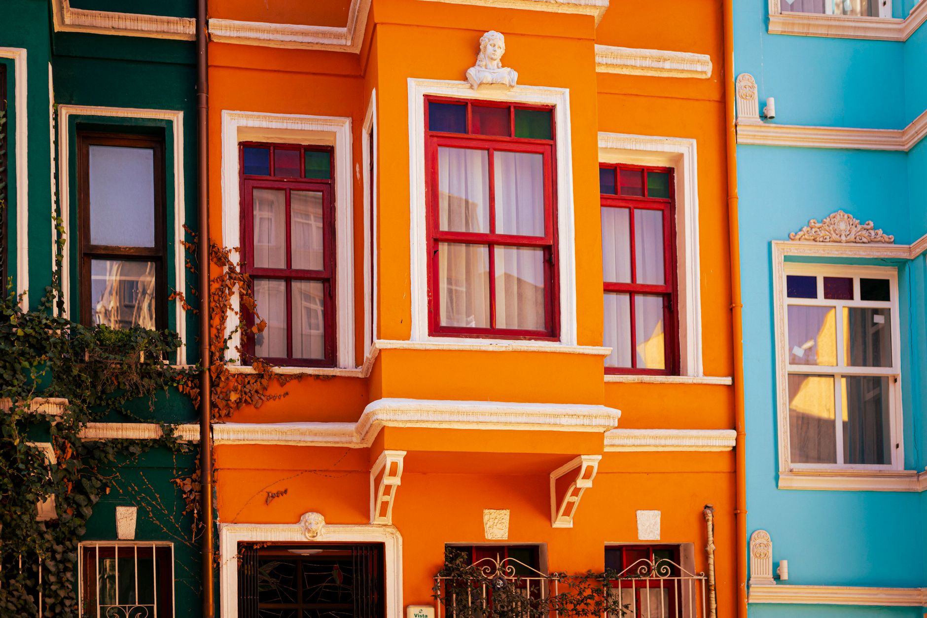 Vibrant colored houses in İstanbul, Türkiye showcasing unique architectural style.