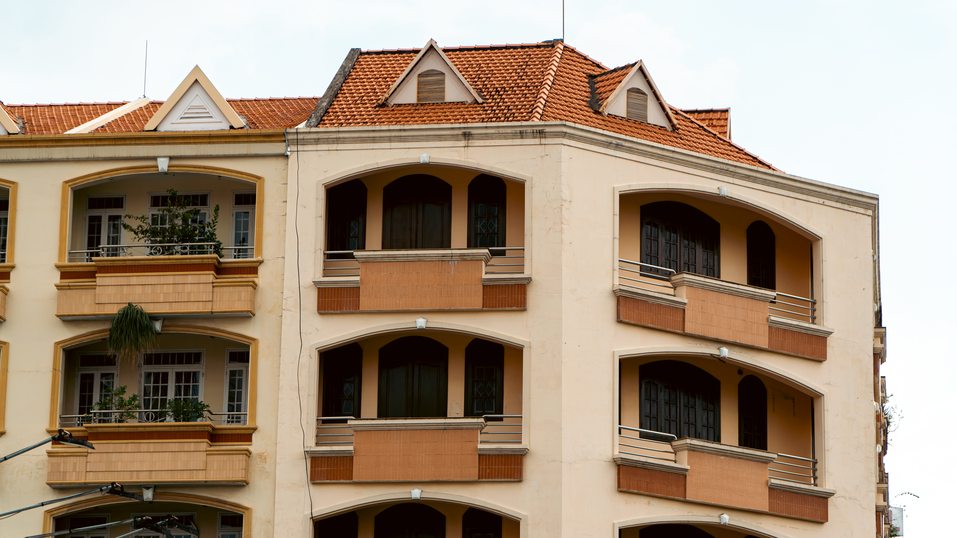 Distinctive architecture of an urban apartment building showcasing balconies.