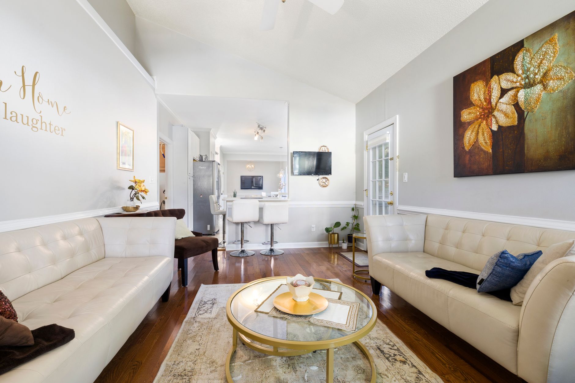Luxurious living room with modern decor featuring sofas, art, and cozy ambience.