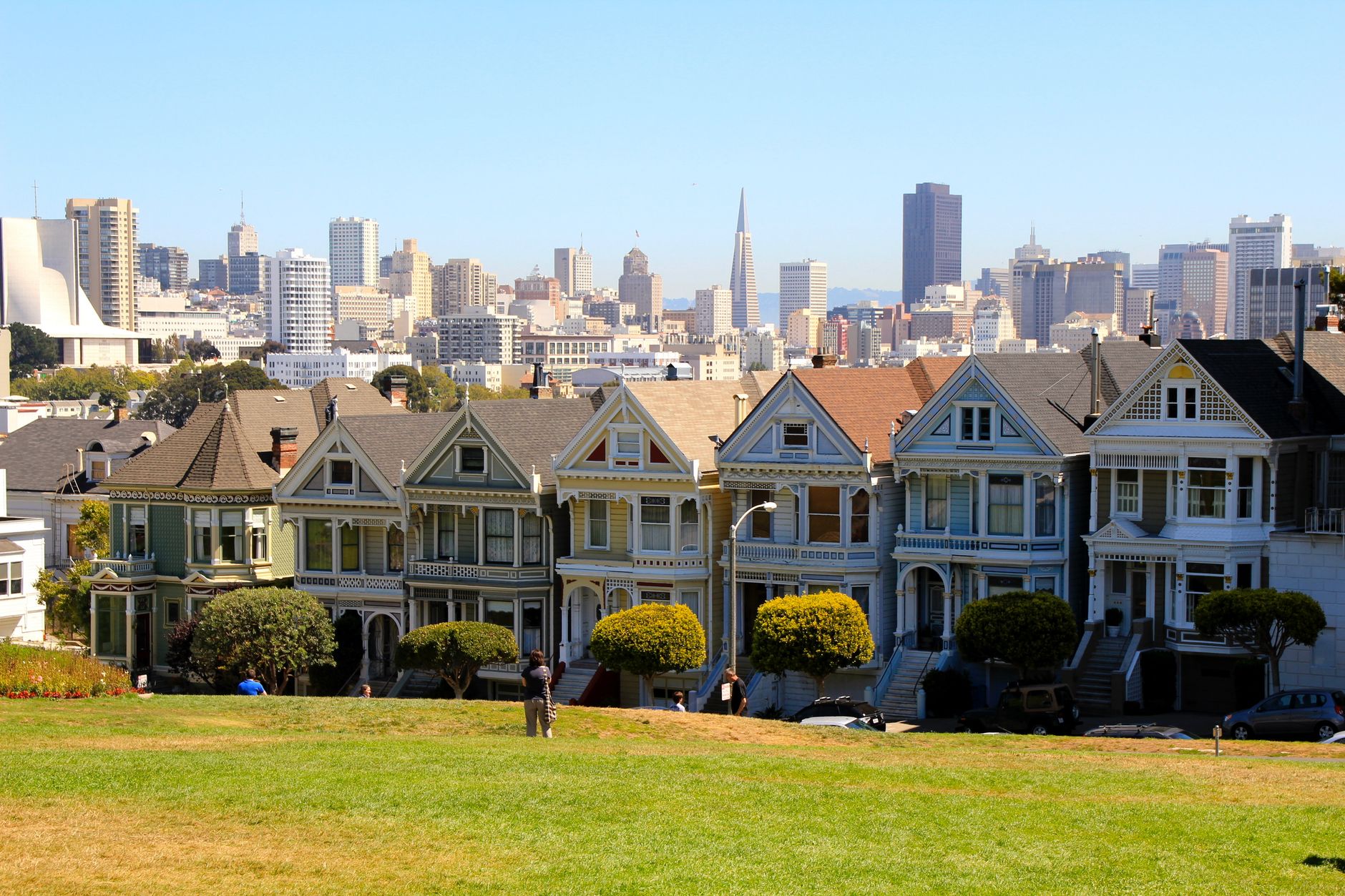 View of the iconic Painted Ladies with San Francisco skyline in background.
