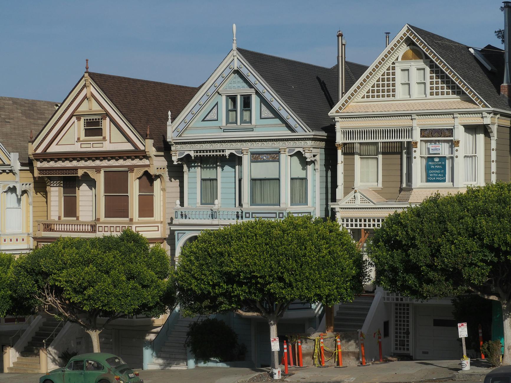 Charming Victorian houses in San Francisco, showcasing classic architecture on a sunny day.