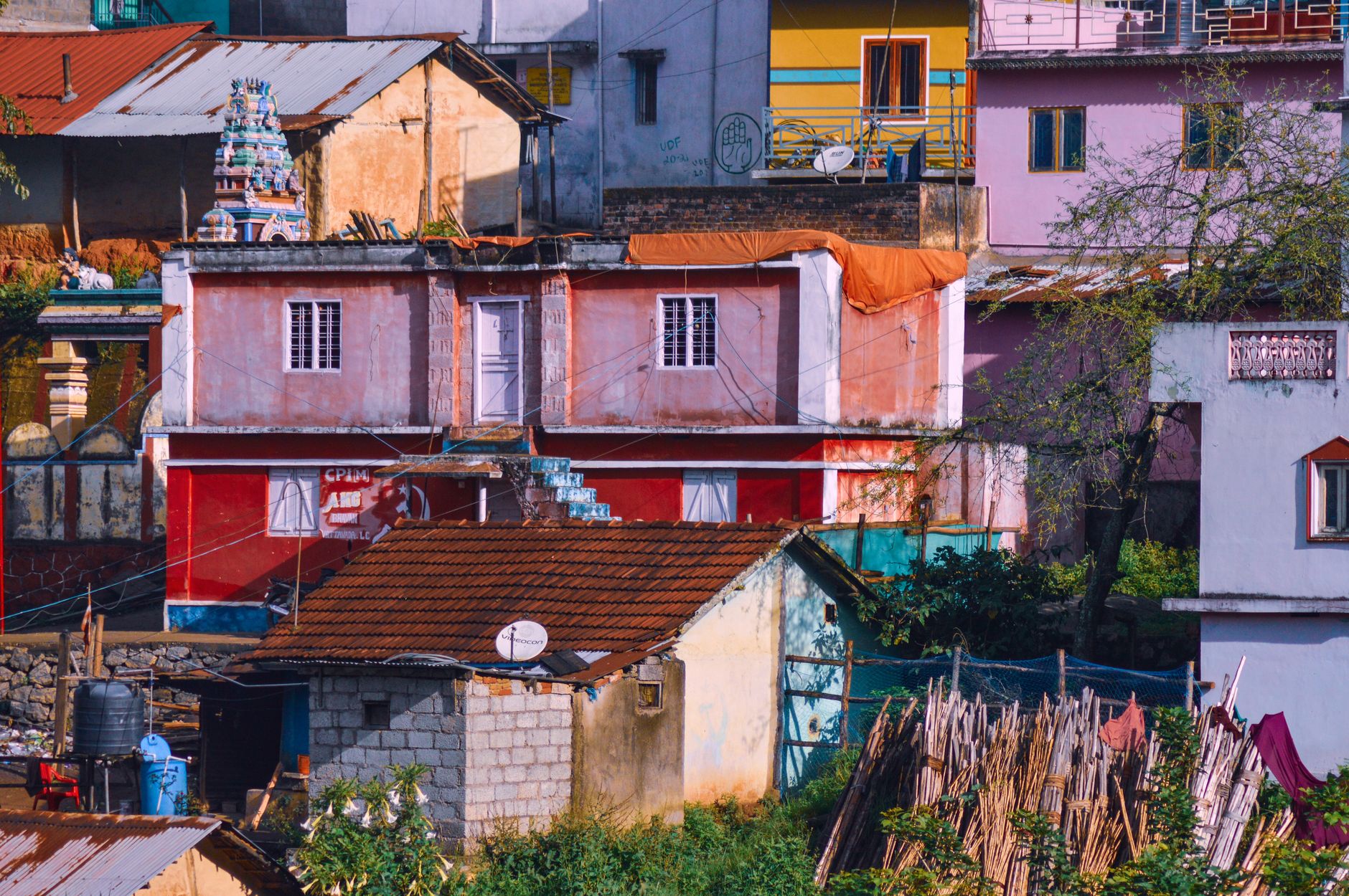 A vibrant mix of colorful houses in an urban residential area with diverse architecture.