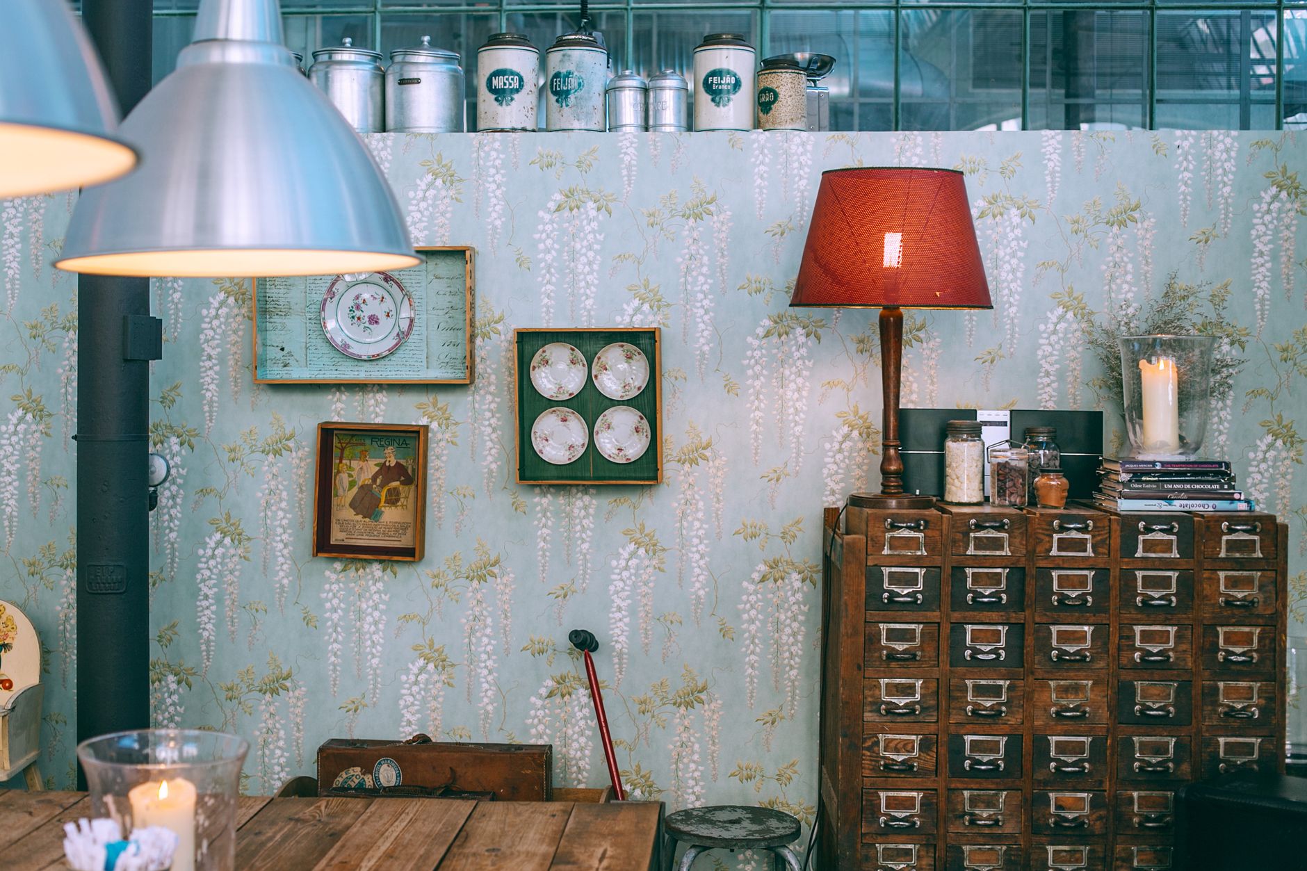Interior of cozy vintage styled apartment with aged wooden furniture and old fashioned clocks and lamps
