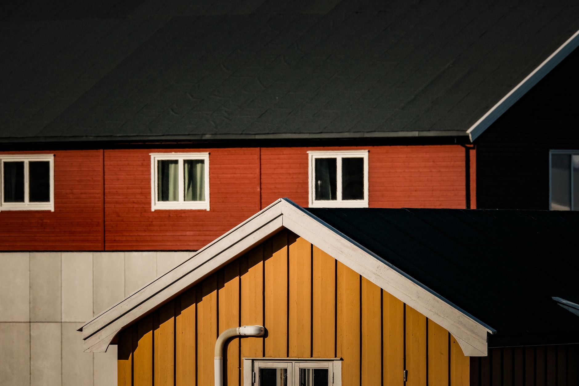 Vivid red and yellow Scandinavian houses with a minimalist and modern style.