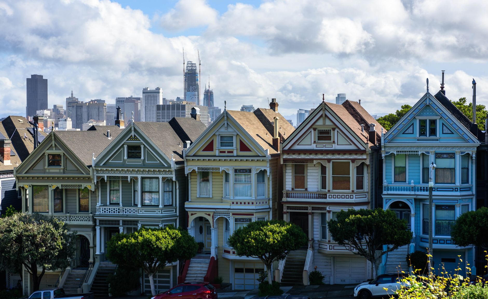 Capture of San Francisco's Painted Ladies with skyline backdrop and vibrant architecture.