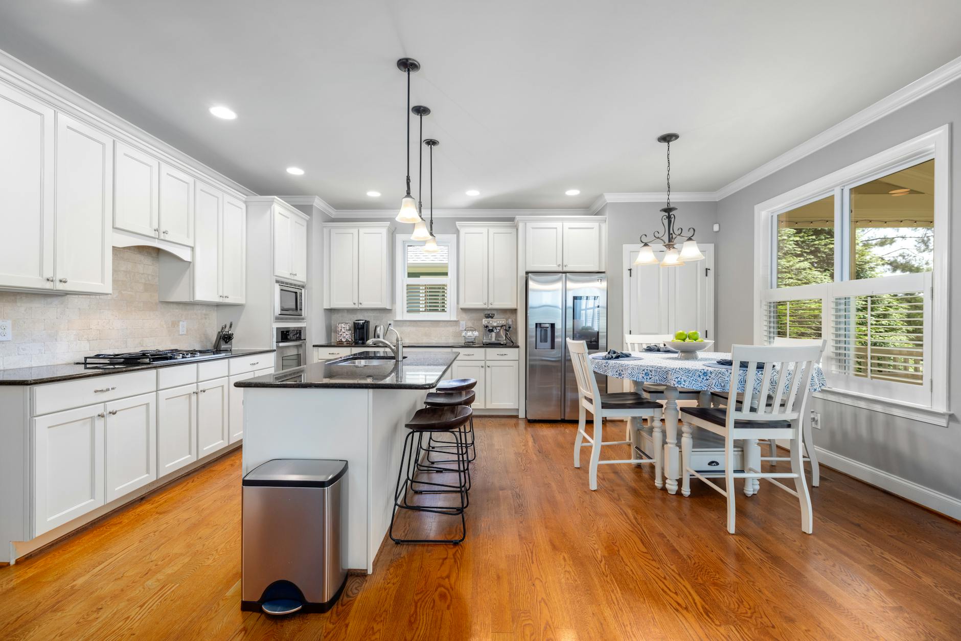 Kitchen cabinets being refinished in a Parkmont home, showing professional prep work