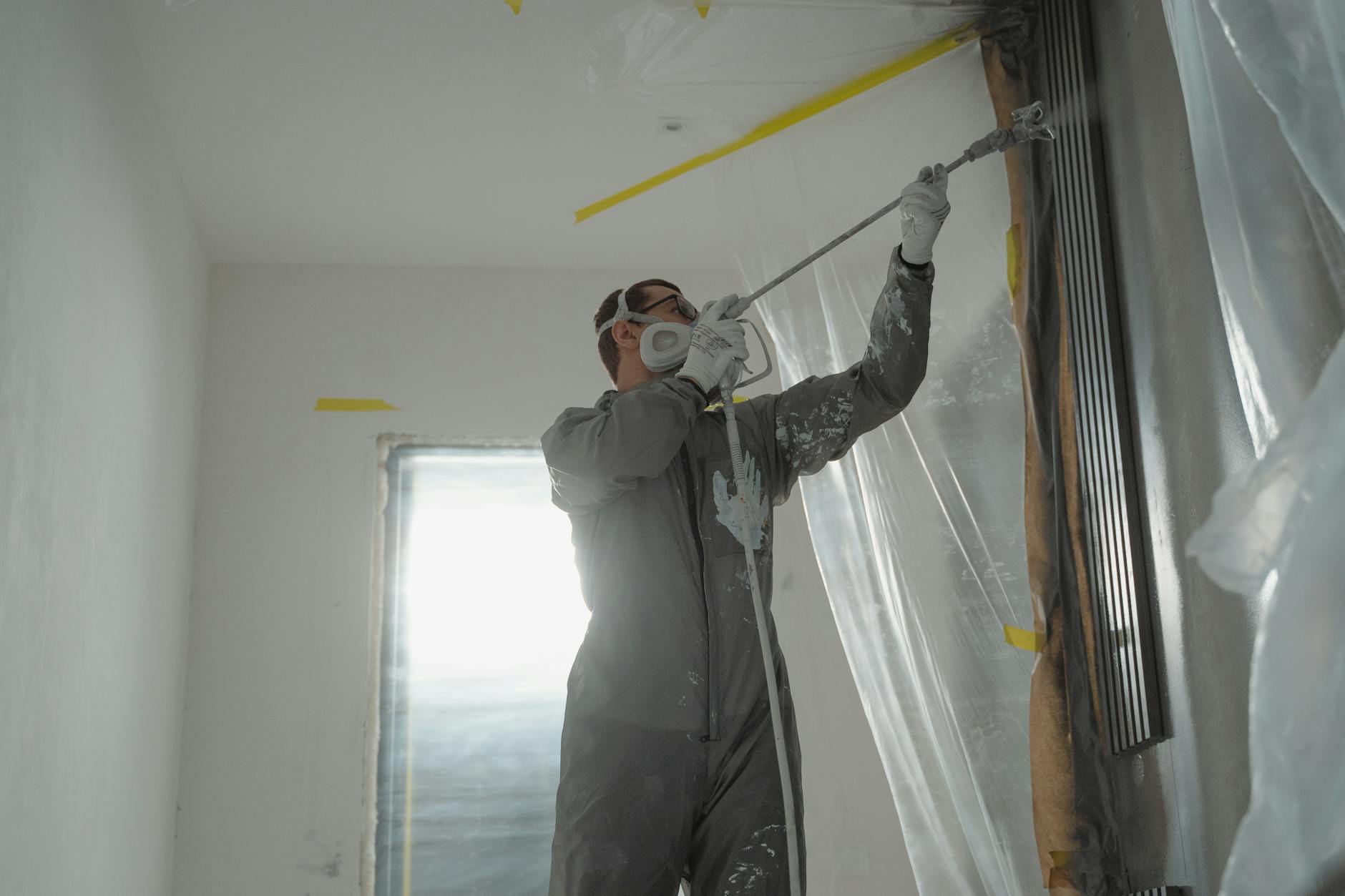 Professional painters prepping a house exterior in California Bay Area