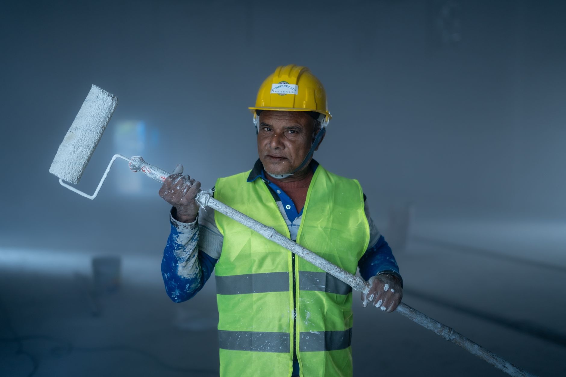 Professional painter conducting quality inspection on commercial property